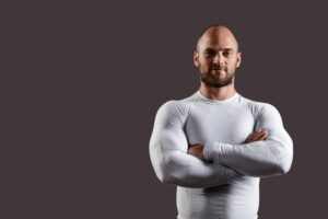 young powerful sportsman white clothing black wall Photoroom 1