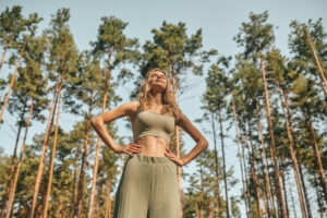 woman practising yoga park looking involved